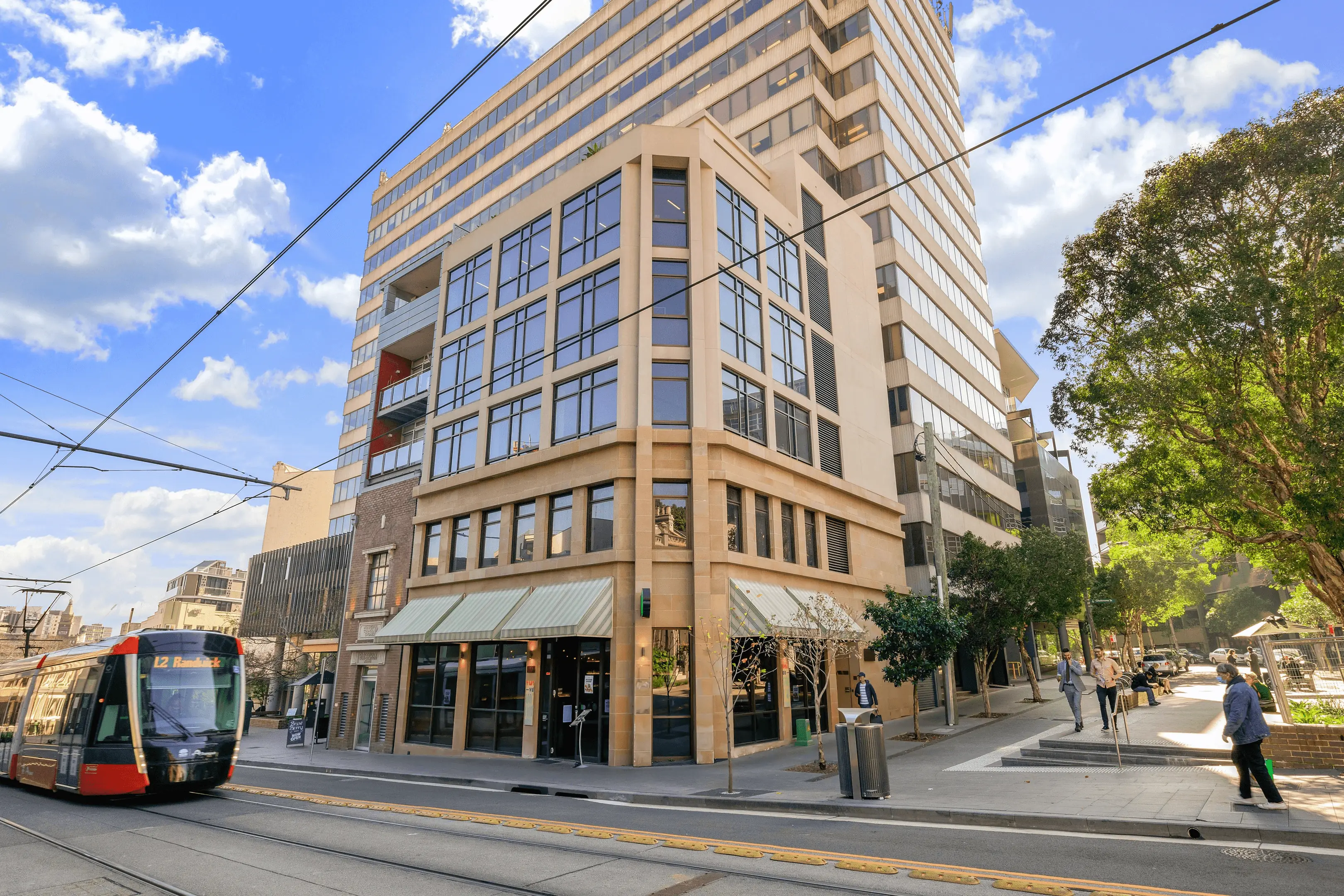 Exterior of a building with orange awnings and a sign above the door that reads “Prospect.”